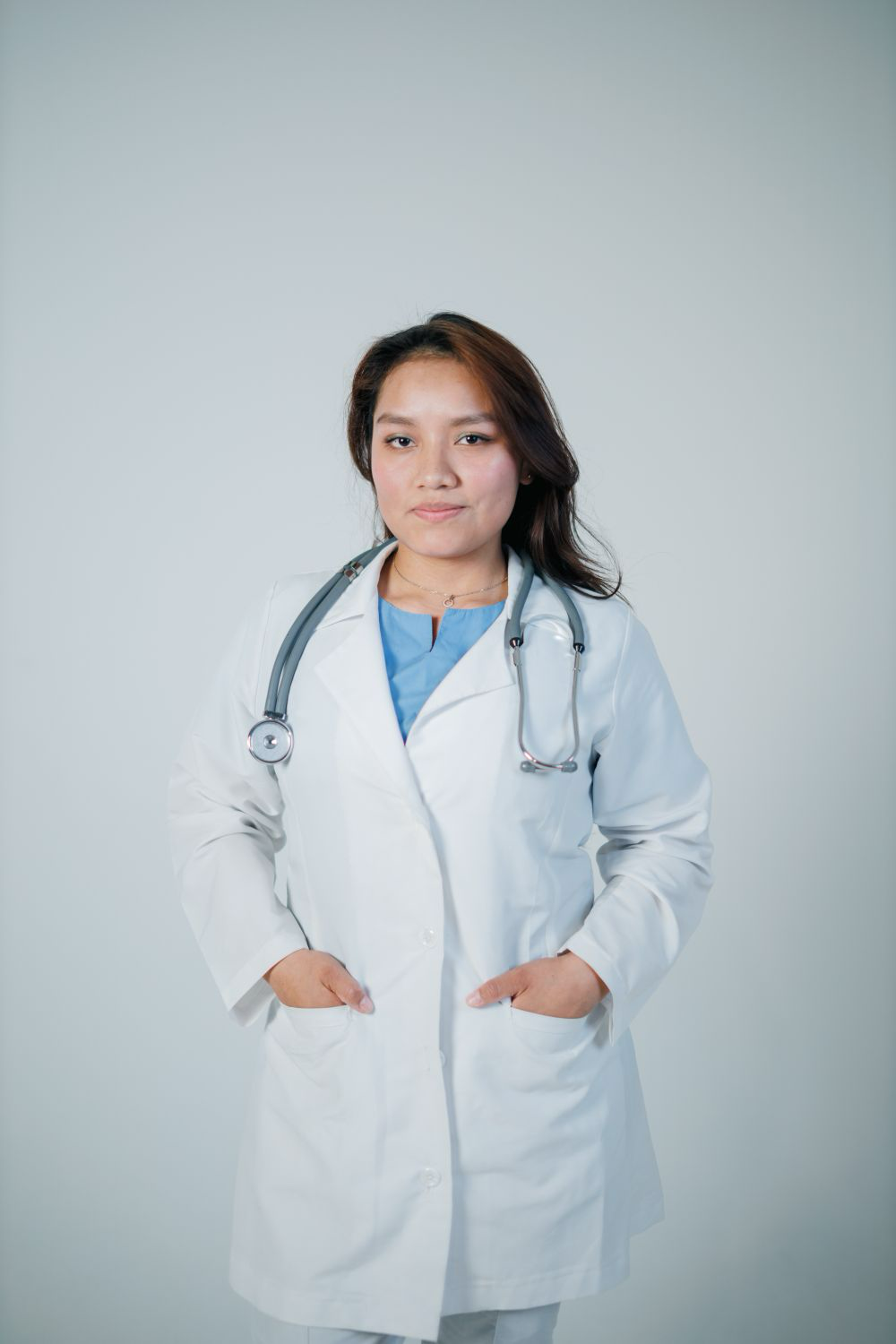 Portrait of a senior physician in a white coat with a stethoscope